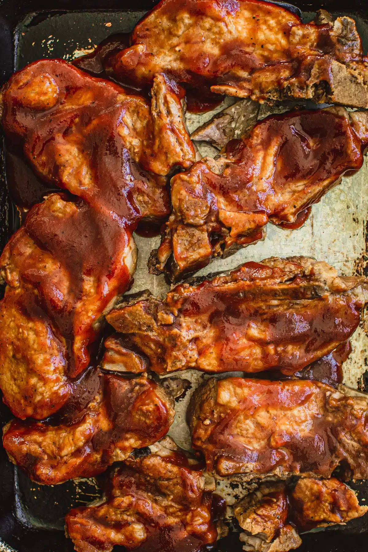 Country style ribs covered in bbq sauce.