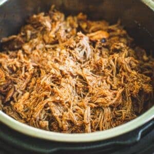 Pulled pork covered in bbq sauce in the Instant Pot.