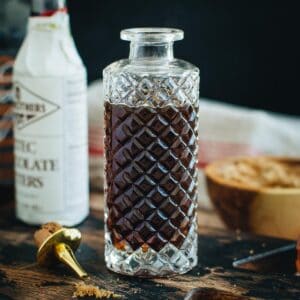 Faceted bottle filled with brown sugar syrup.