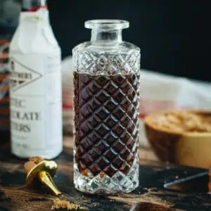 Faceted bottle filled with brown sugar syrup.