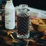 Demerara syrup in a faceted glass bottle.