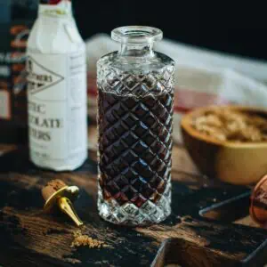 Demerara syrup in a faceted glass bottle.