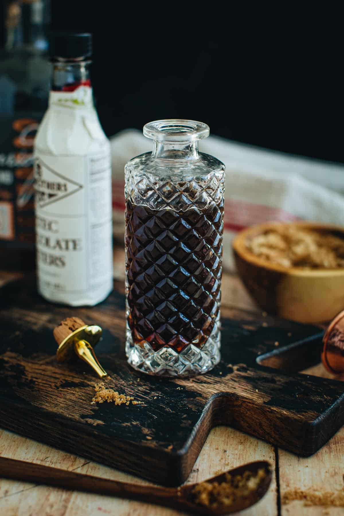 Demerara syrup in a faceted glass bottle.