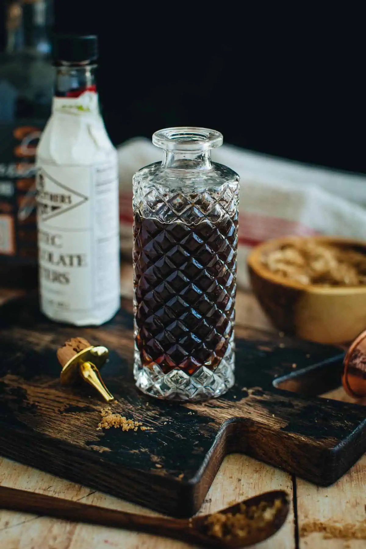 Demerara simple syrup in a faceted bottle.