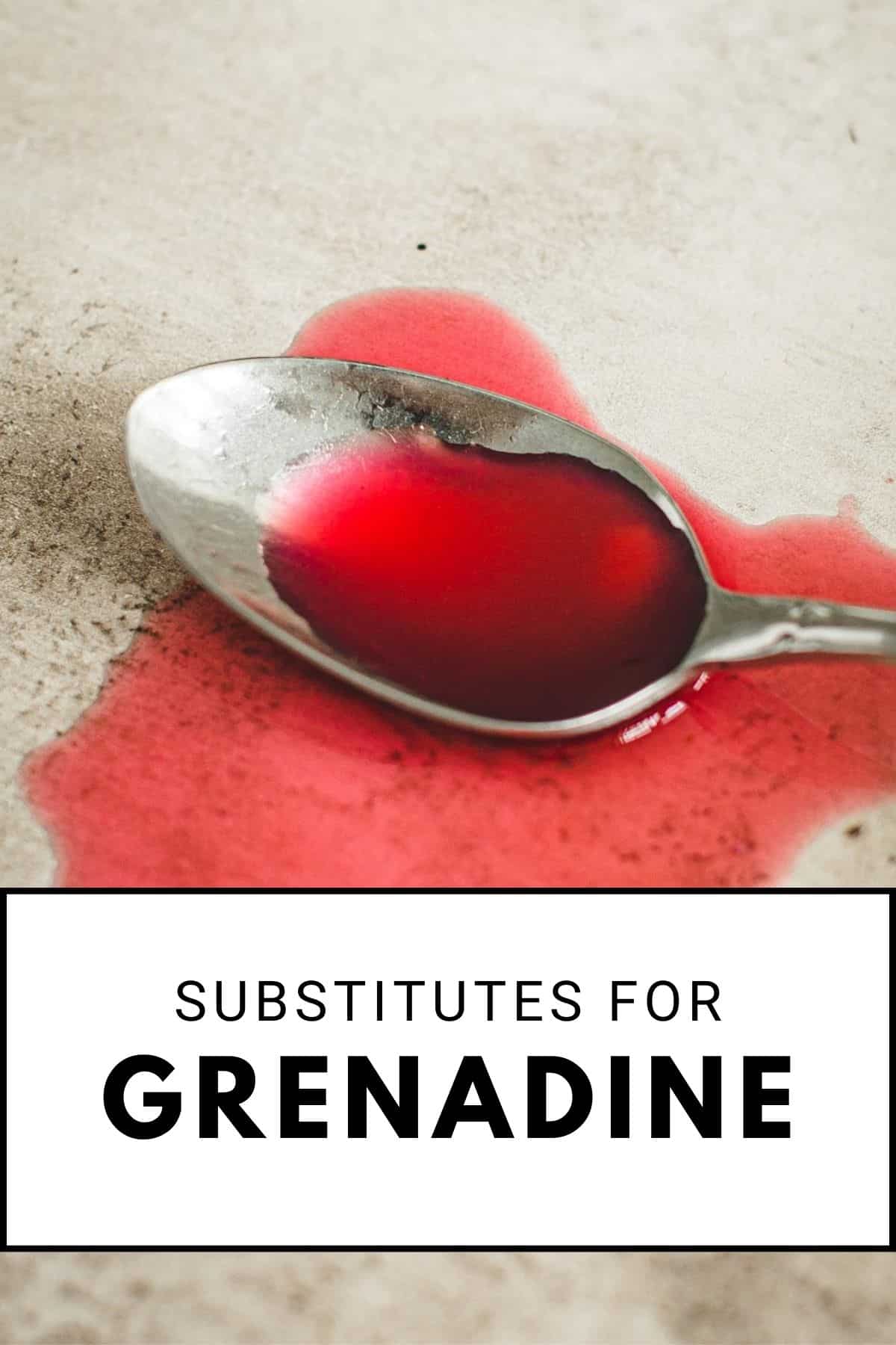 Grenadine on a spoon and spilled around it.