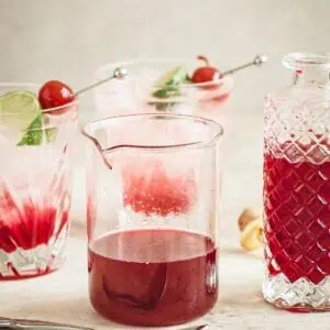 Grenadine syrup in a glass jar.