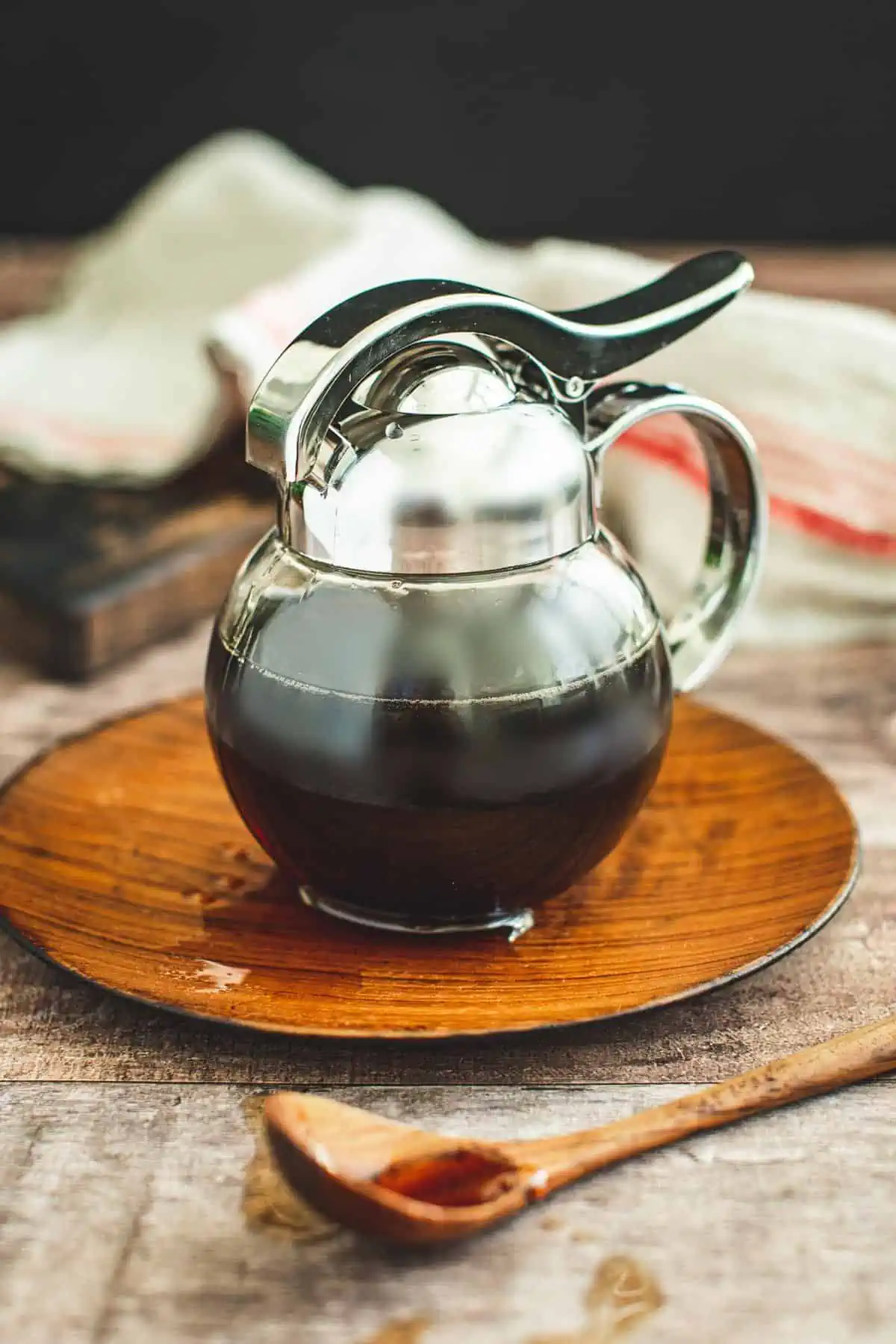 Homemade maple syrup in a dispenser.