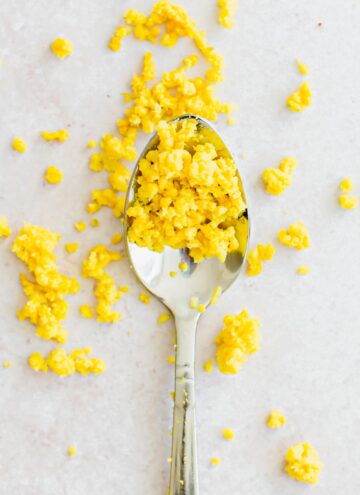 Lemon zest on a silver spoon.