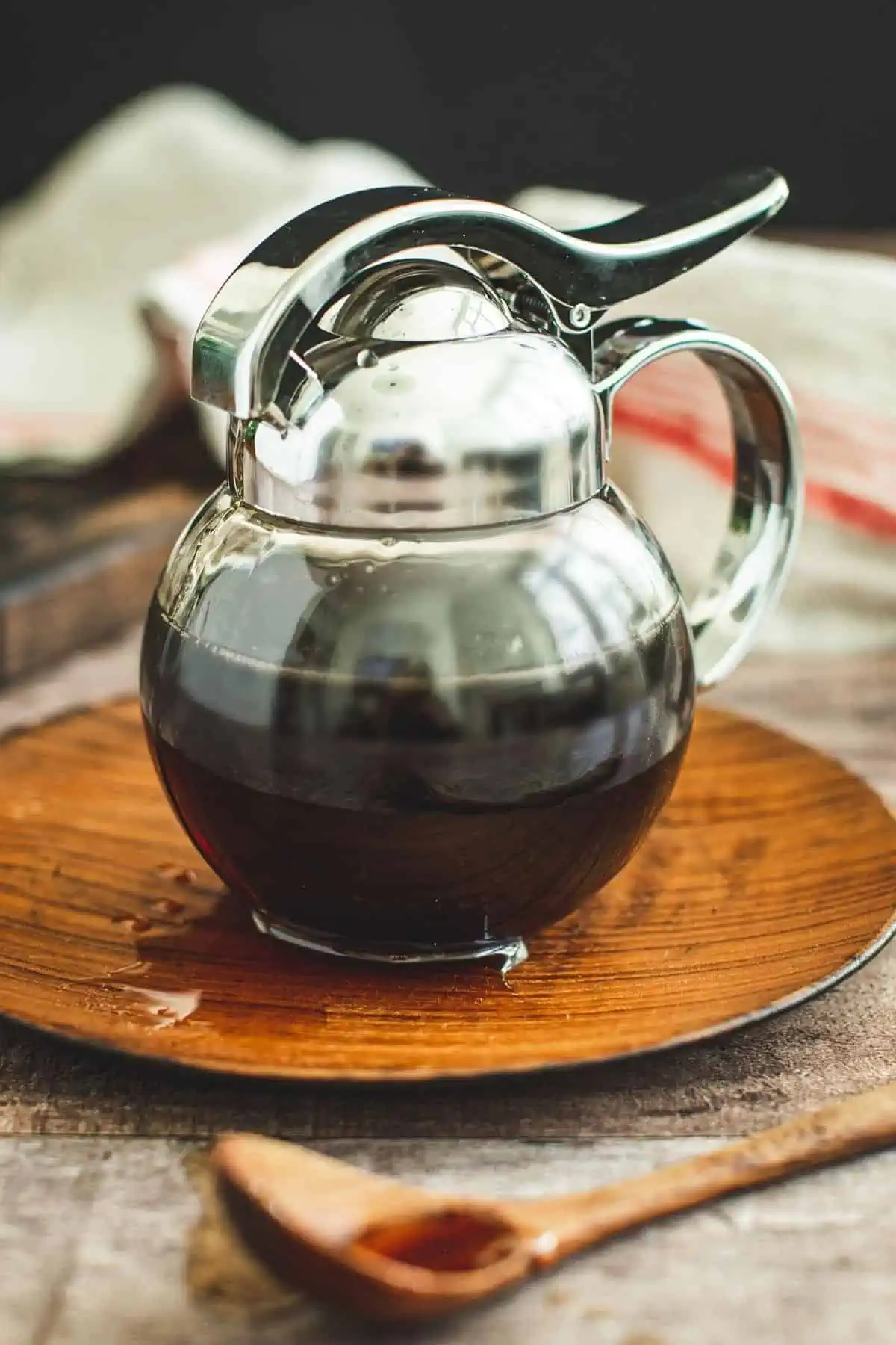 Homemade maple syrup in a dispenser.