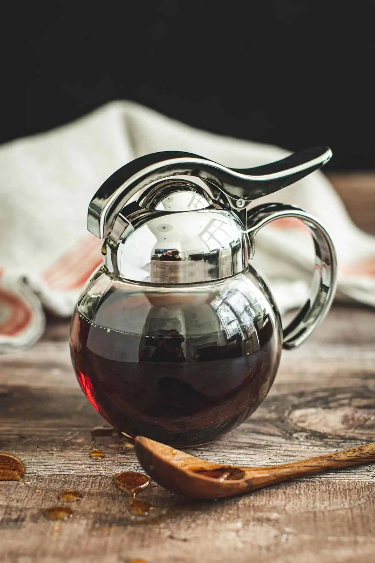 Maple syrup substitute in a syrup dispenser.