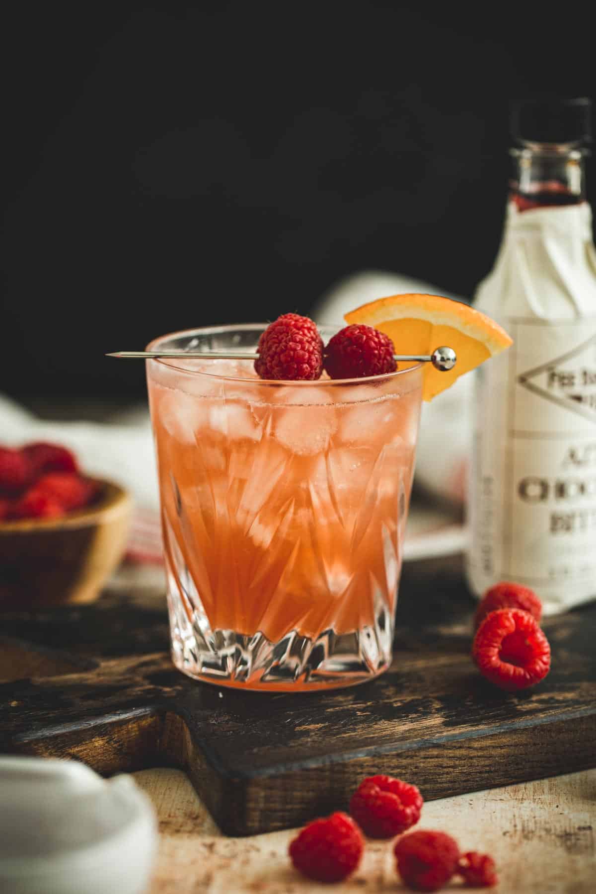 Raspberry sour garnished with fresh raspberries.