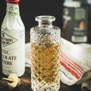 Simple syrup in a faceted glass bottle.