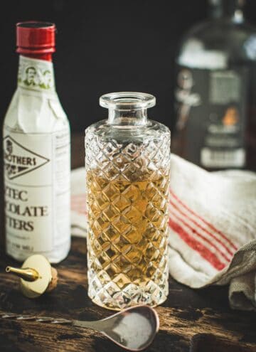 Simple syrup in a faceted glass bottle.