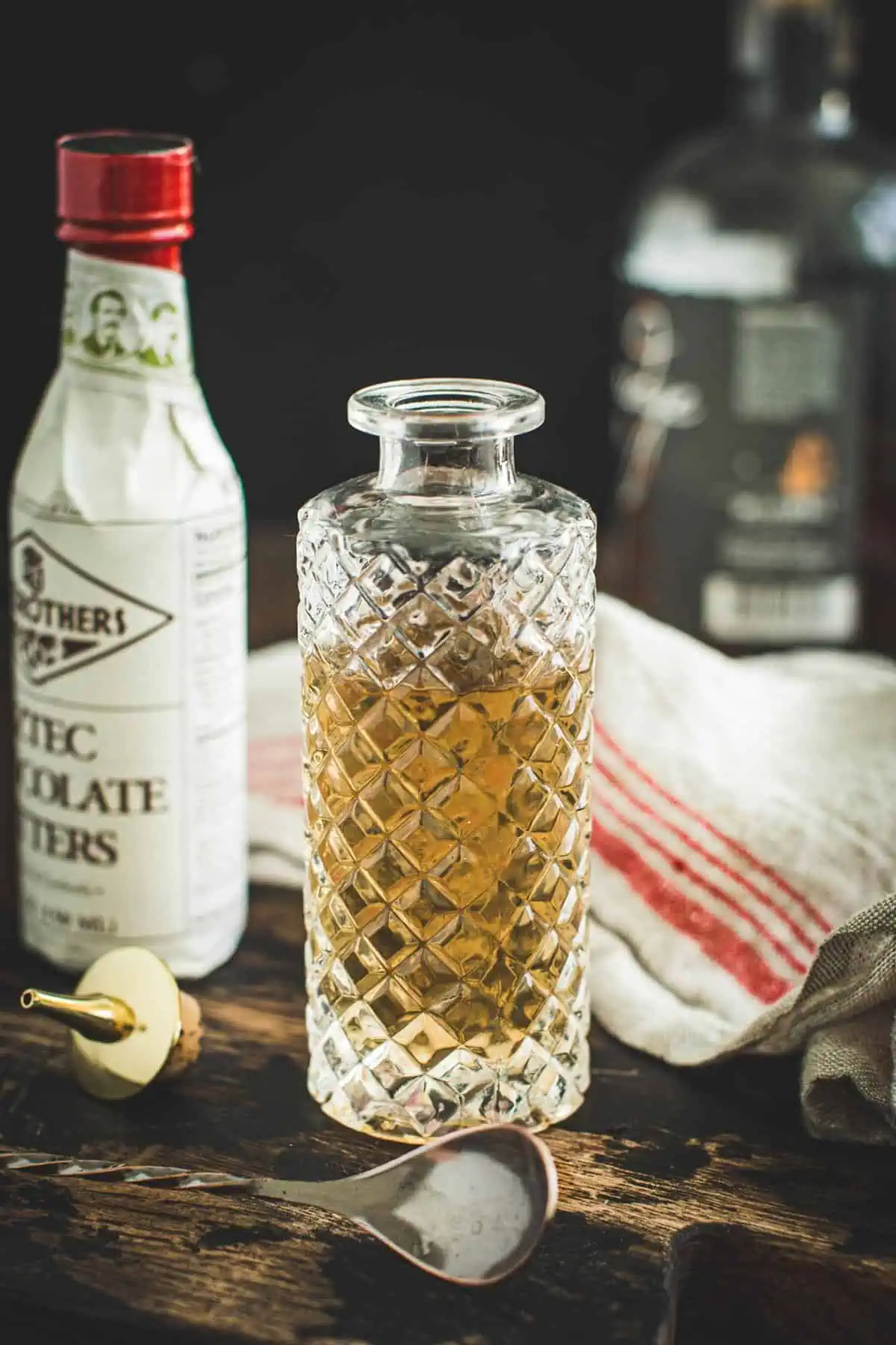 Simple syrup in a faceted glass bottle.