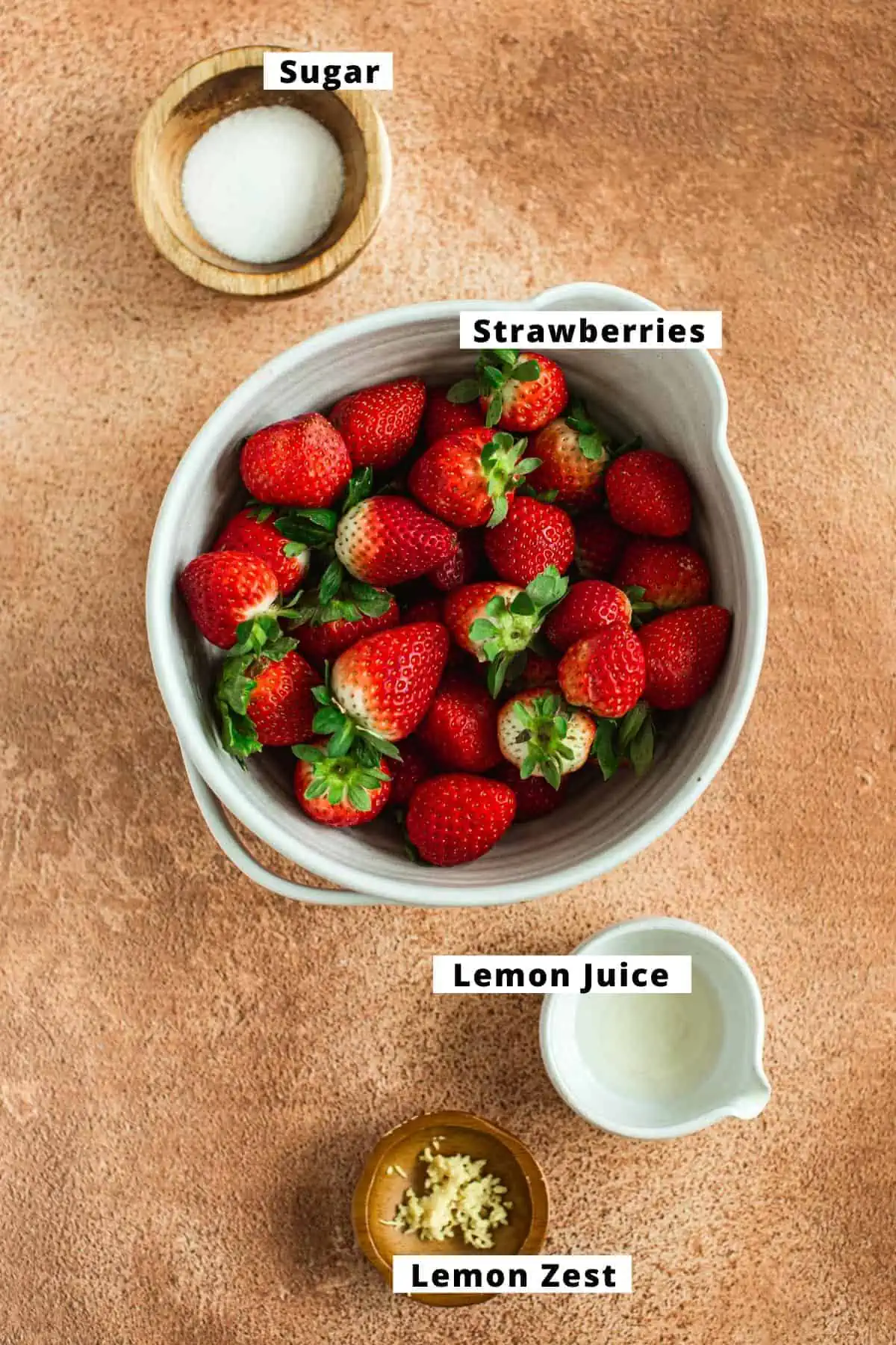 Strawberry compote ingredients in various bowls.