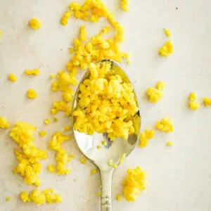 Lemon zest on a spoon and spread around it.