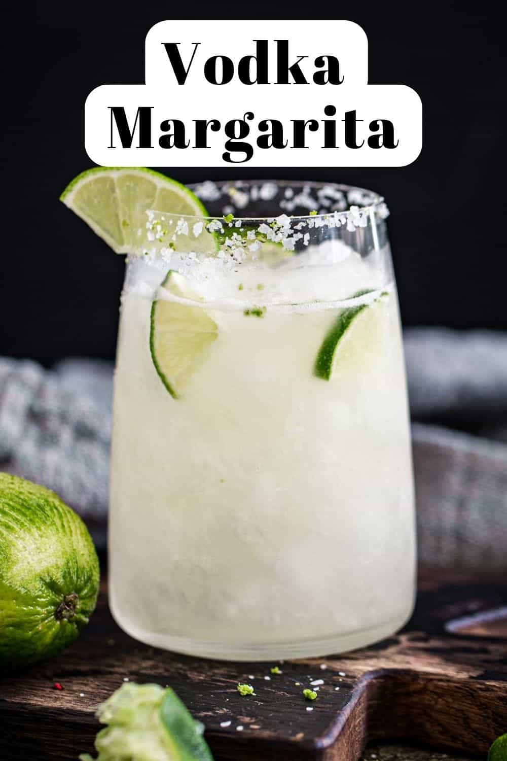 Margarita with vodka and a lime wedge with a salted rim.