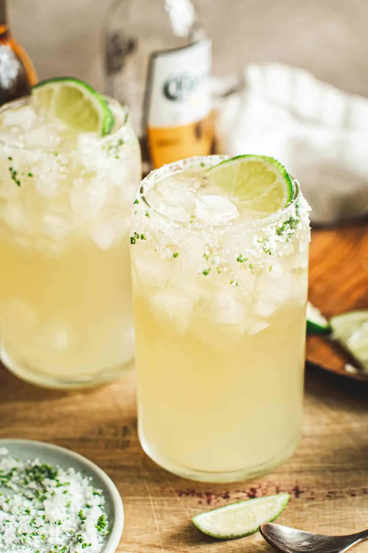 Beer margarita with a salted rim and a lime wedge for garnish.