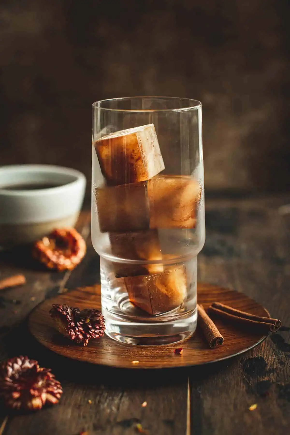 Coffee ice cubes in a glass.