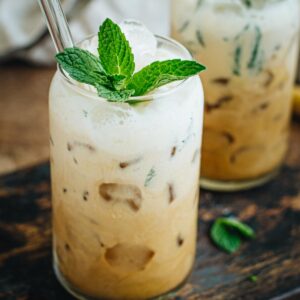 Mint mojito iced coffee topped with mint leaves.