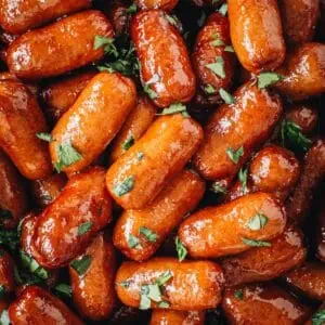 Crockpot little smokies topped with fresh cilantro.