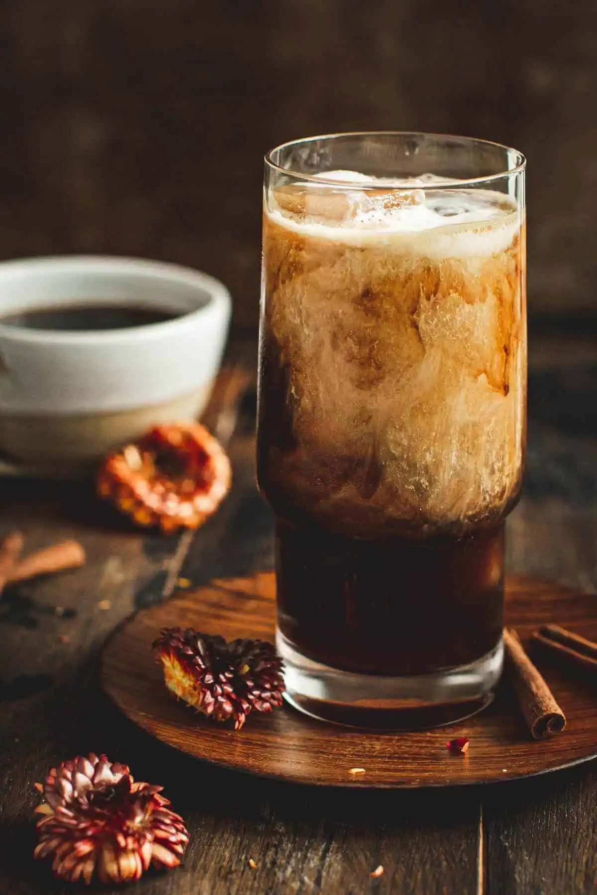 Hazelnut coffee with coffee ice cubes and cream.