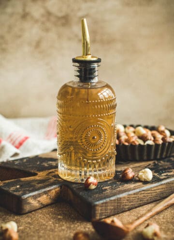 Hazelnut syrup in a bottle with a spout.