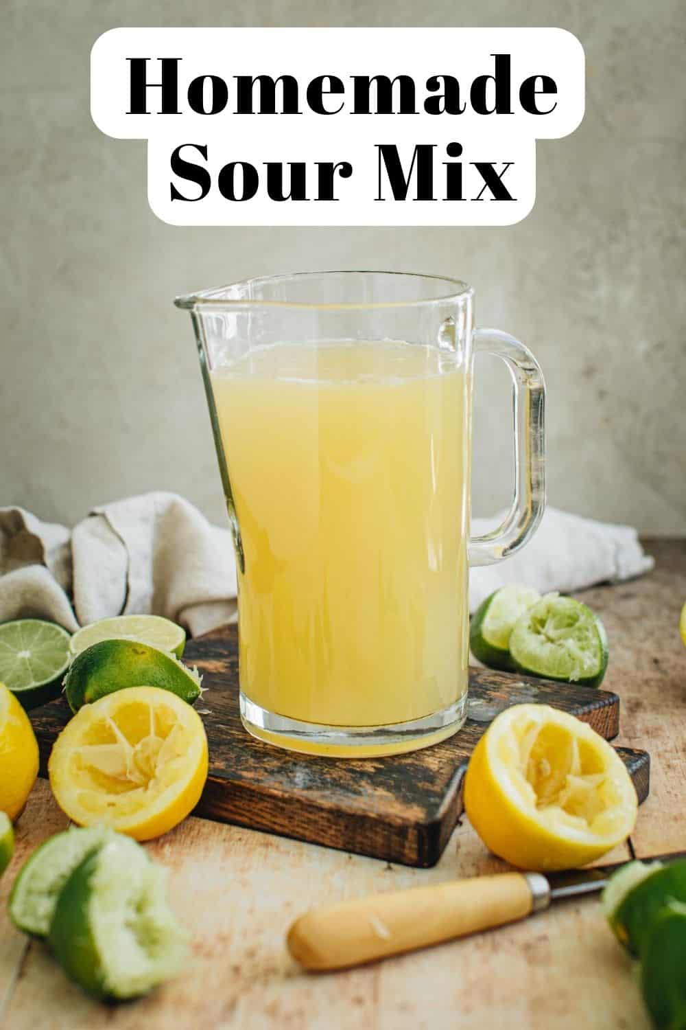 Homemade sour mix recipe in a pitcher.