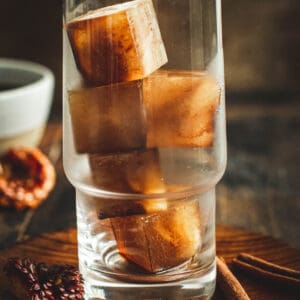 Glass filled with coffee ice cubes.