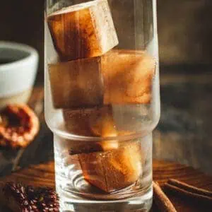 Glass filled with coffee ice cubes.