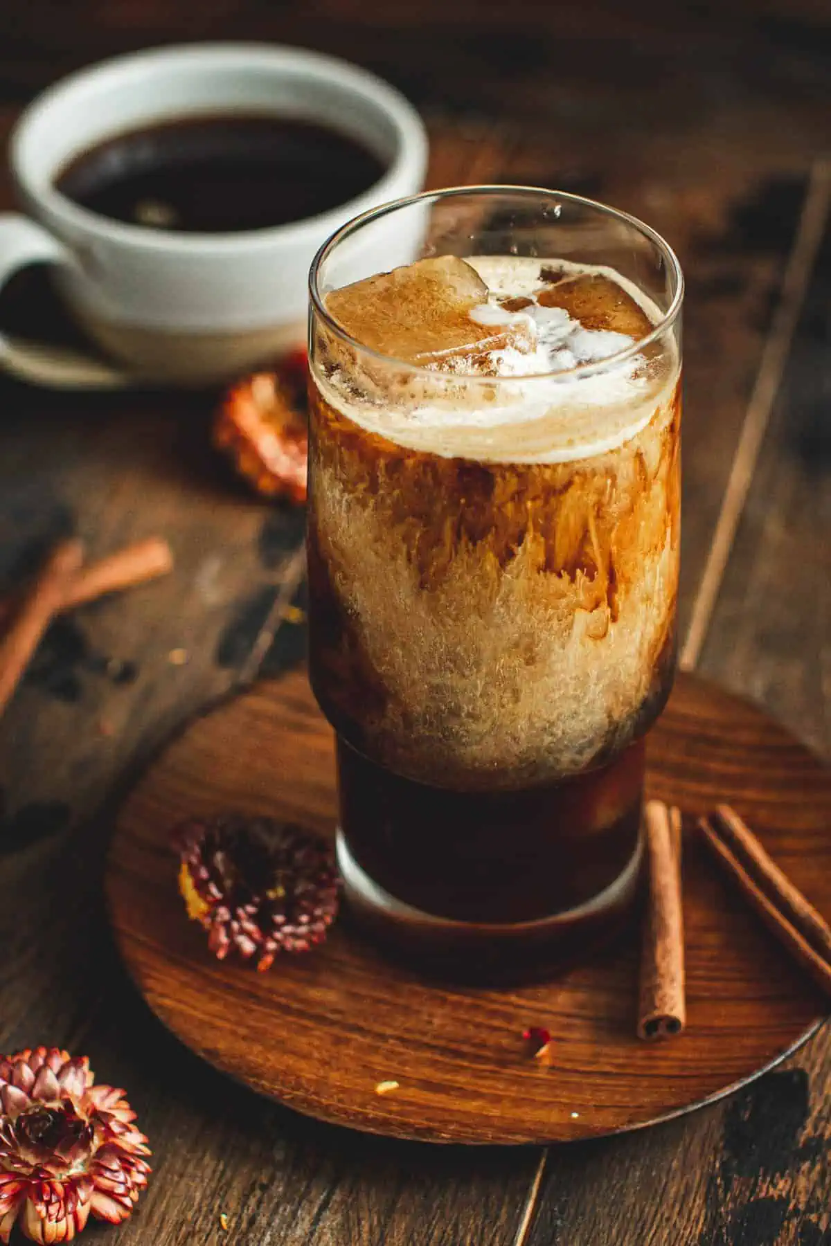 Iced hazelnut coffee in a glass with cream.