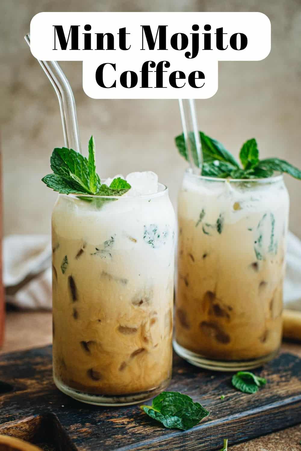 Mint mojito coffee in glasses topped with fresh mint.