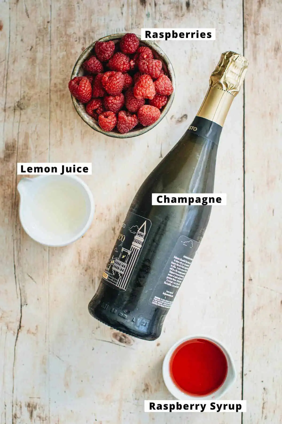 Ingredients in a raspberry champagne cocktail.