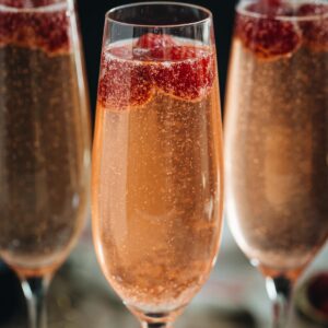 Raspberry champagne in flutes.