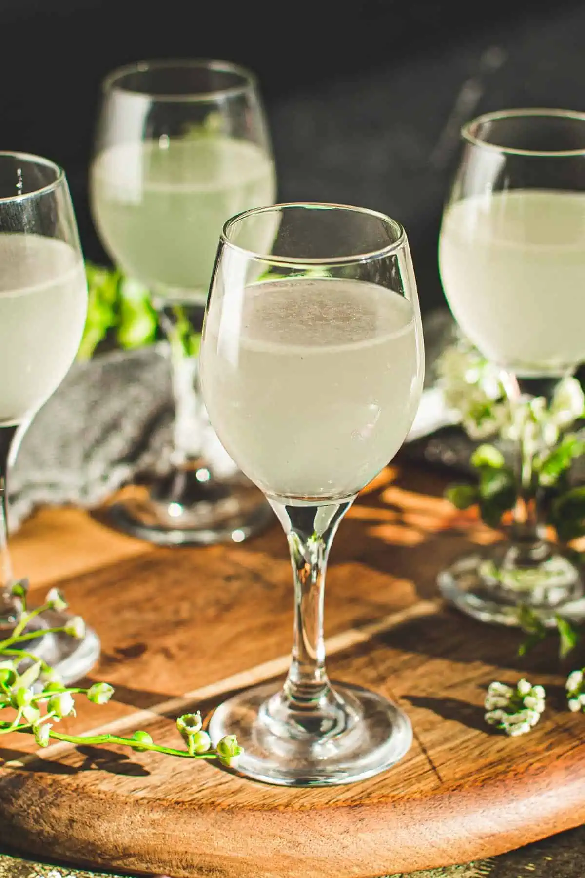 White tea shot with vodka in a shot glass.