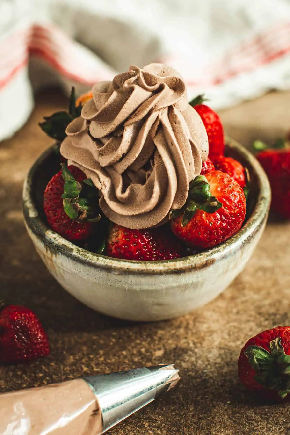 Chocolate whipped cream over strawberries.
