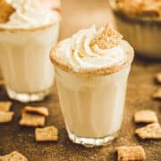 Cinnamon toast crunch shots topped with whipped cream.