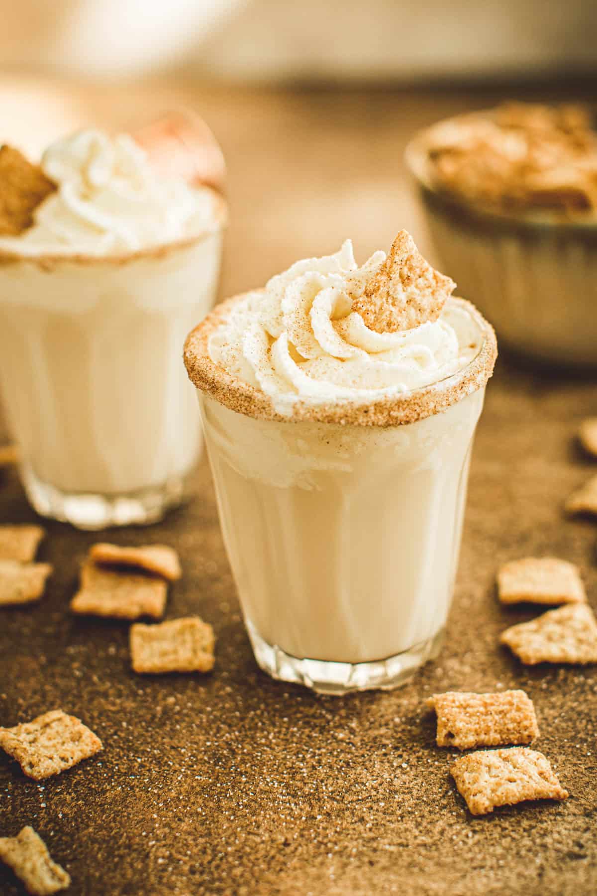 Cinnamon toast crunch shots topped with whipped cream.