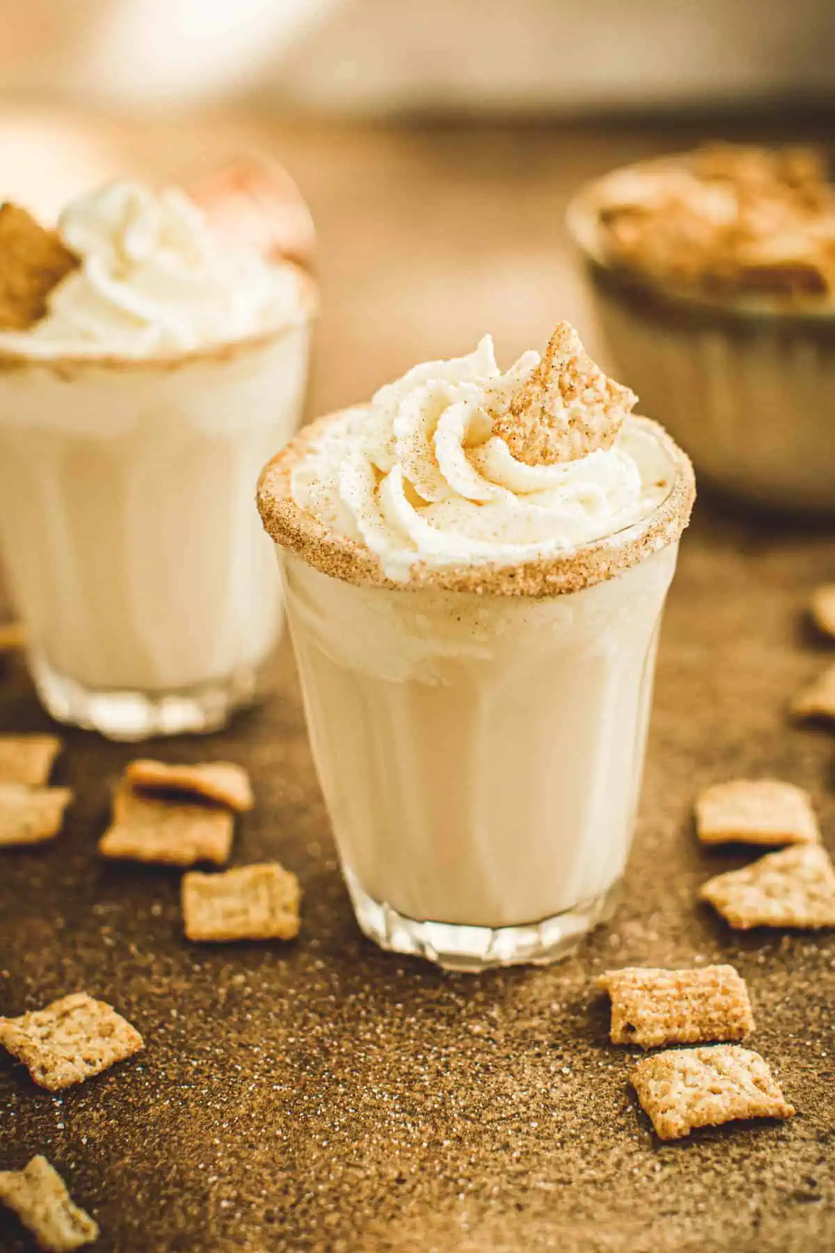 Cinnamon toast crunch shots topped with whipped cream.