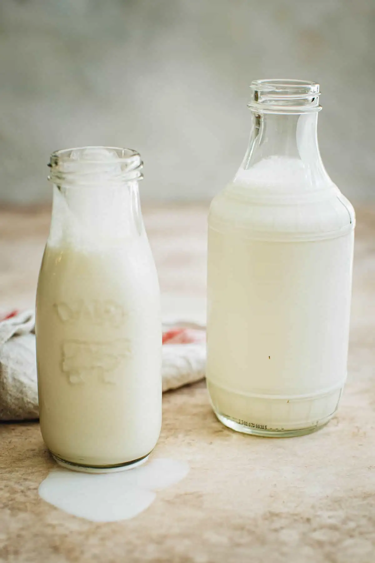 Bottle of heavy cream and a bottle of heavy whipping cream.