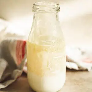 Homemade heavy cream in a milk jug.