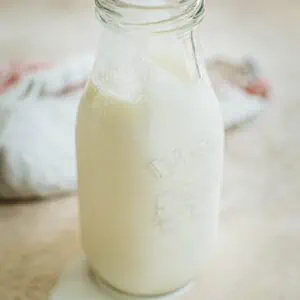 Homemade heavy cream in a milk bottle.