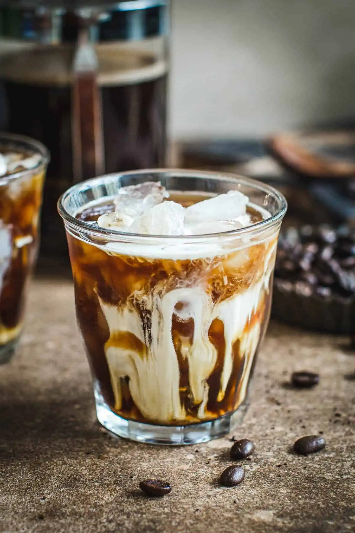 Iced coffee in a glass with cream.