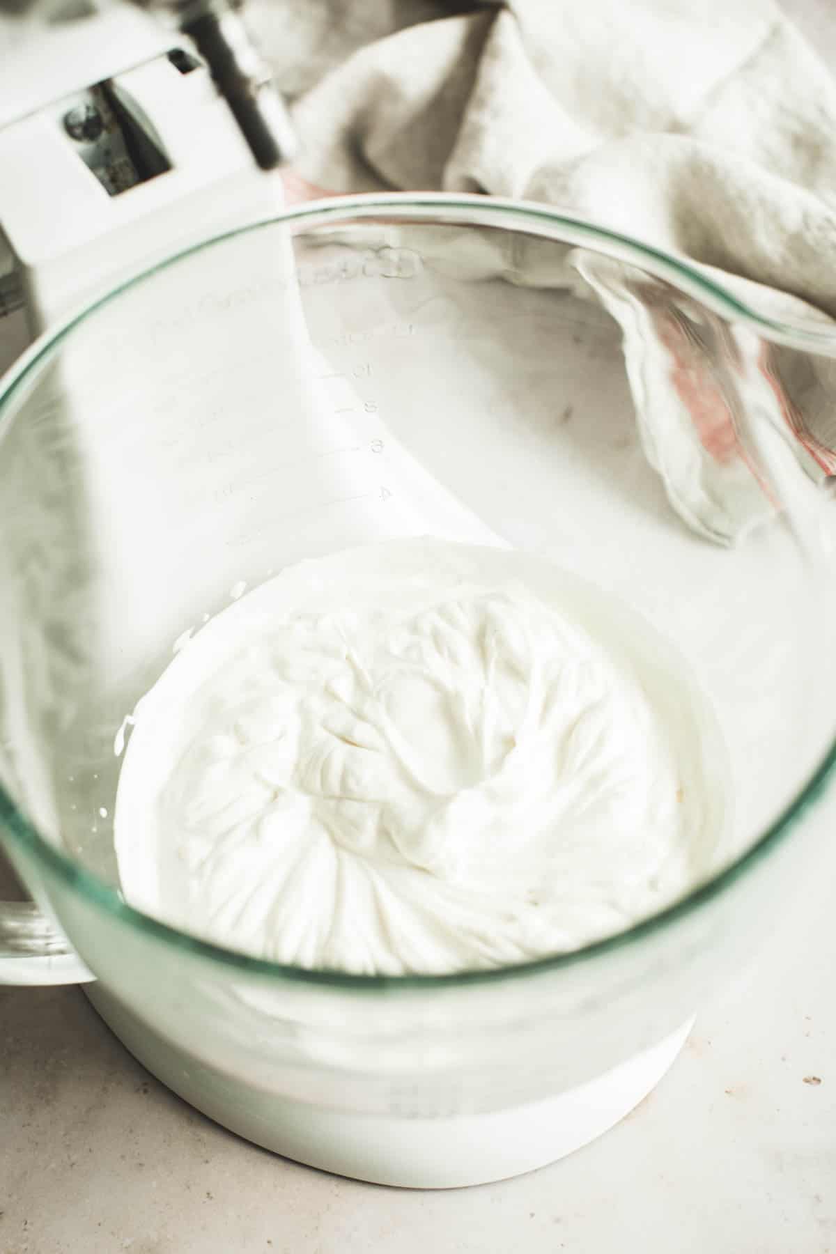 Whipped cream in a mixing bowl.