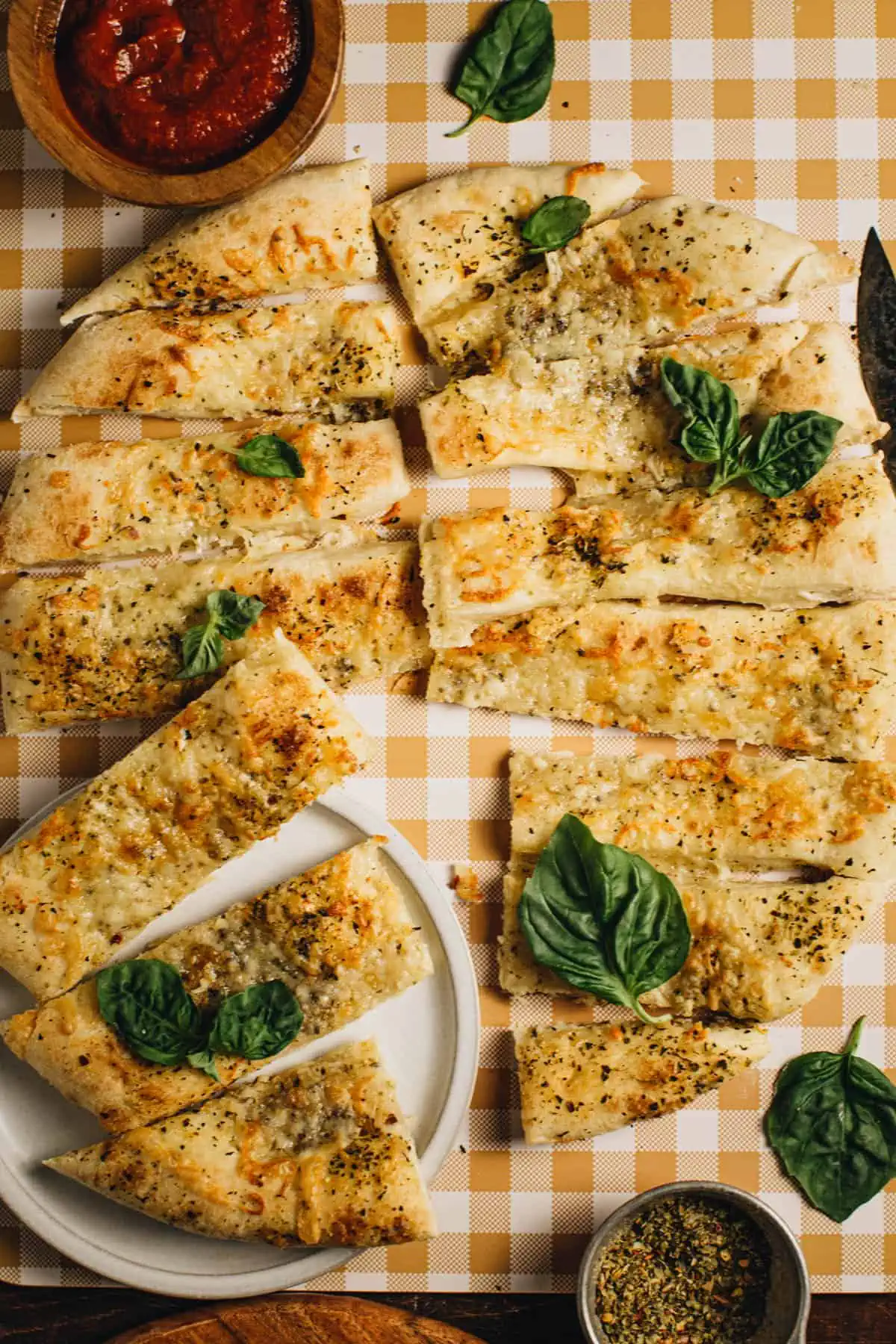 Pizza dippers topped with fresh basil.