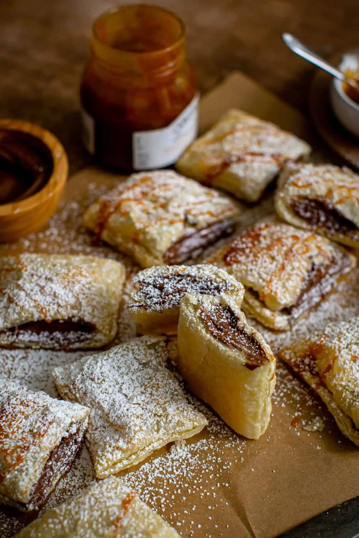 Nutella puff pastries covered in powdered sugar.