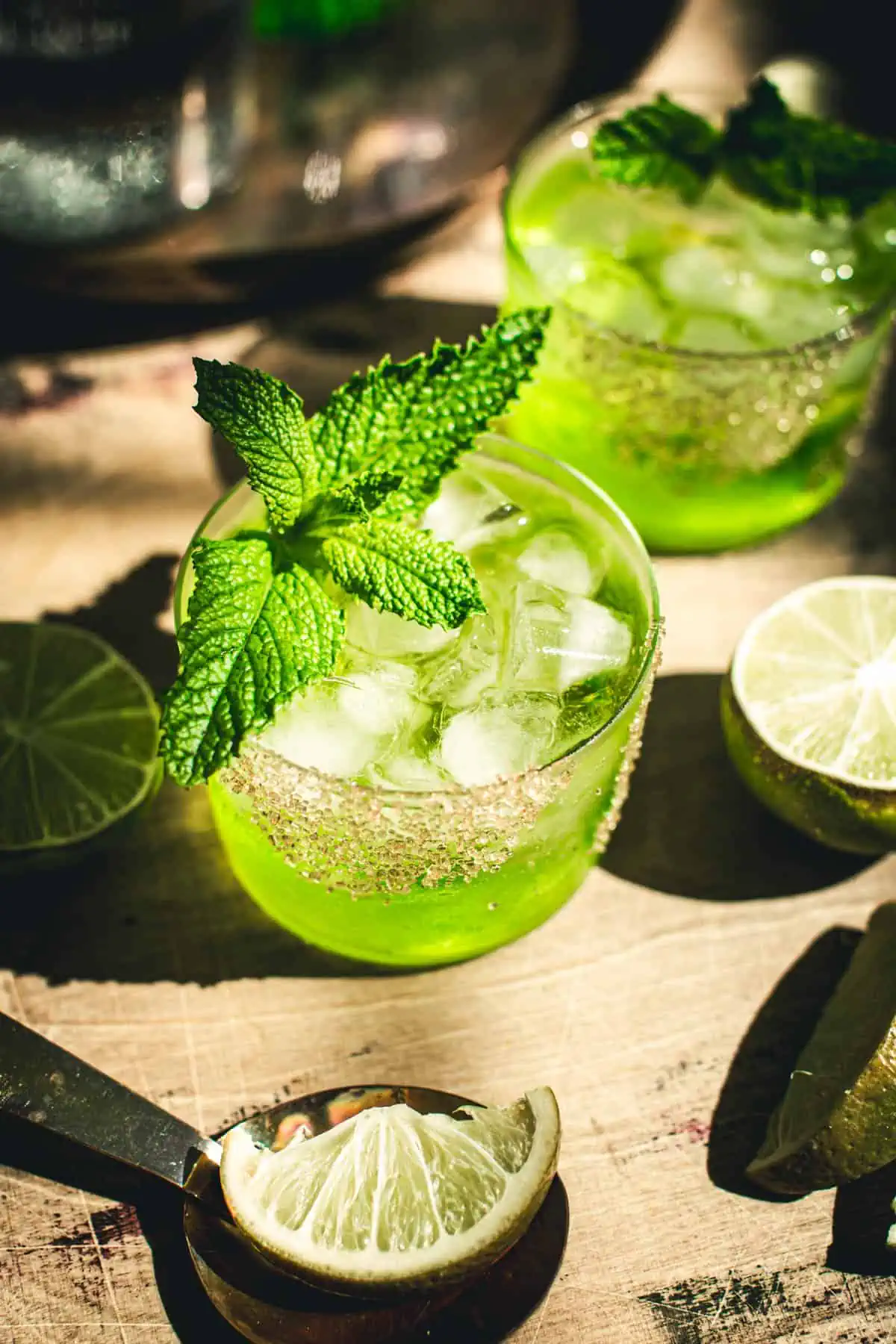 Caribbean water cocktail with a mint garnish.
