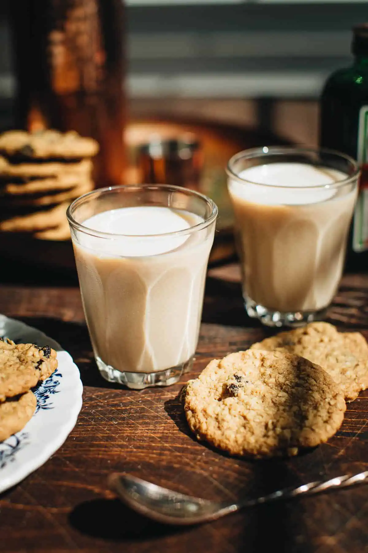 Oatmeal cookie shots next to an oatmeal cookie.