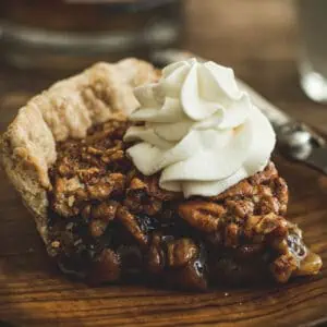 Bourbon whipped cream on top of pecan pie.