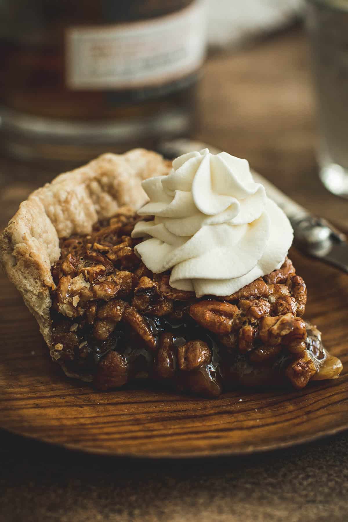 Bourbon whipped cream on top of pecan pie.